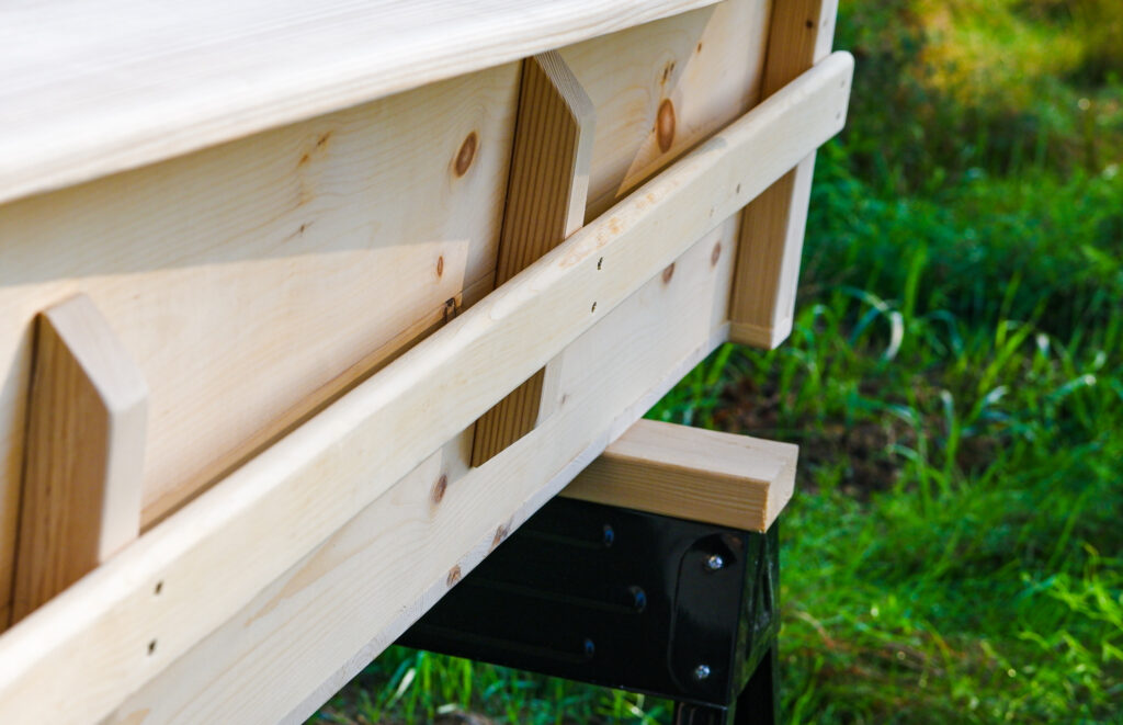 side view of finished casket showing hand rail.
